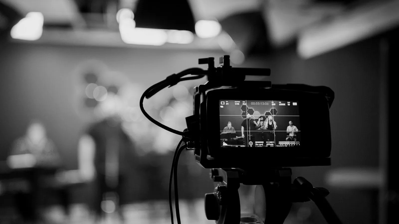 A video camera recording a performance in a studio
